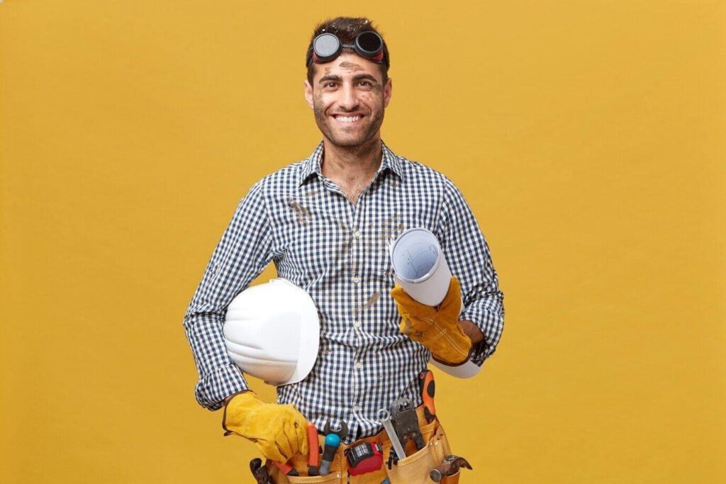 Skilled handyman standing confidently after completing home repair in Dubai